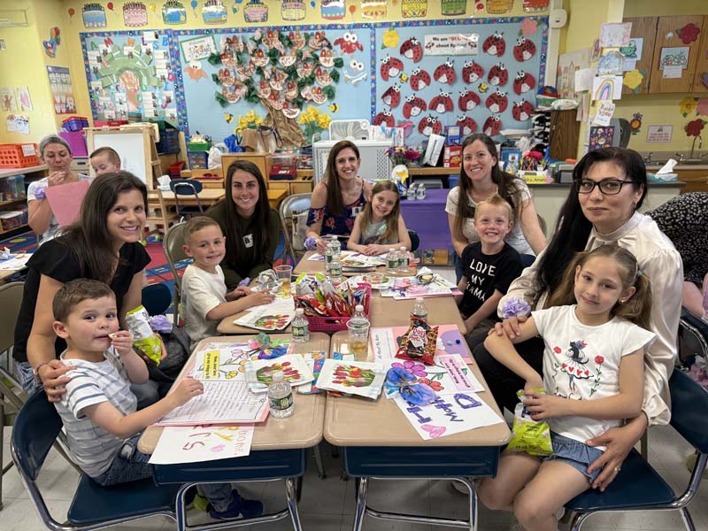 Moms and children smiling