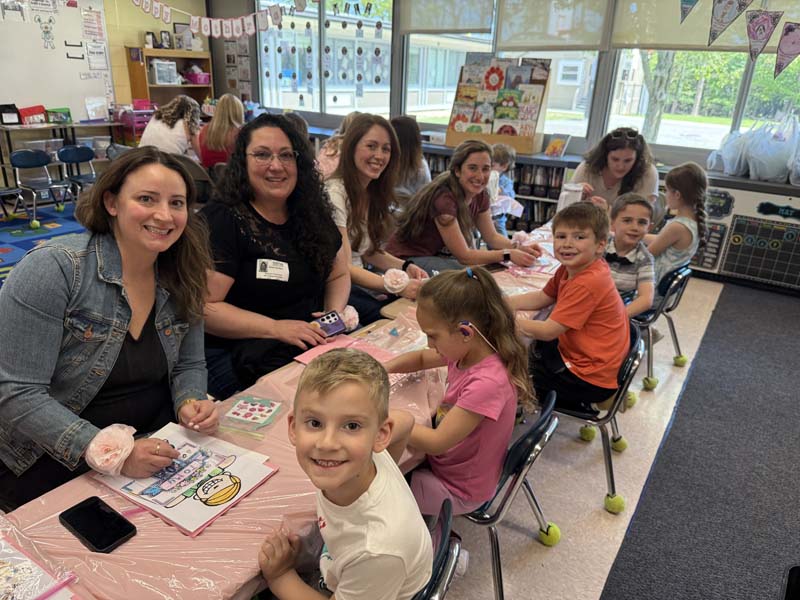 Moms and children smiling