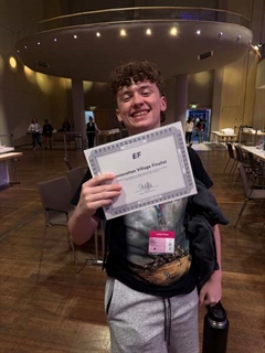 Student holding certificate