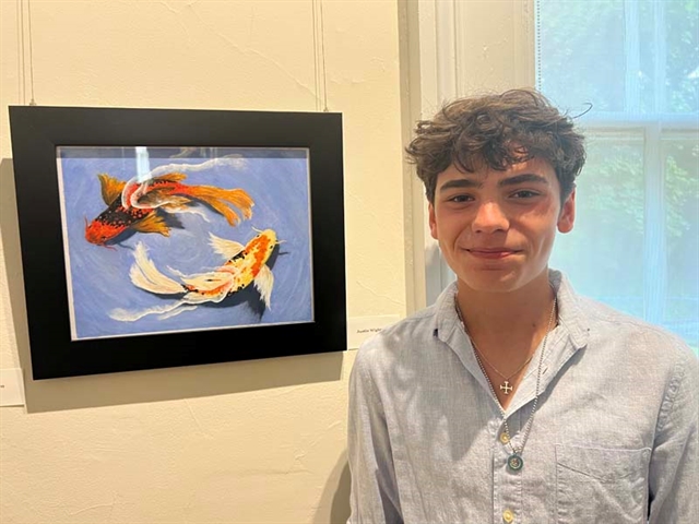 student with artwork