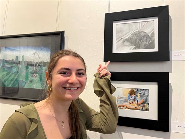 student with artwork
