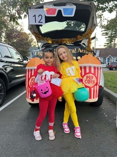 students smiling in halloween costumes