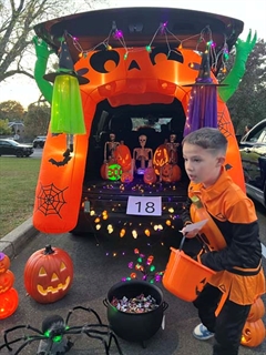 students smiling in halloween costumes