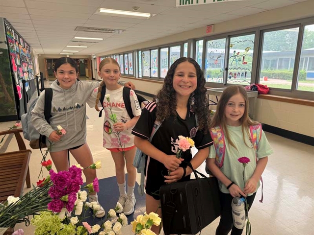 students with flowers