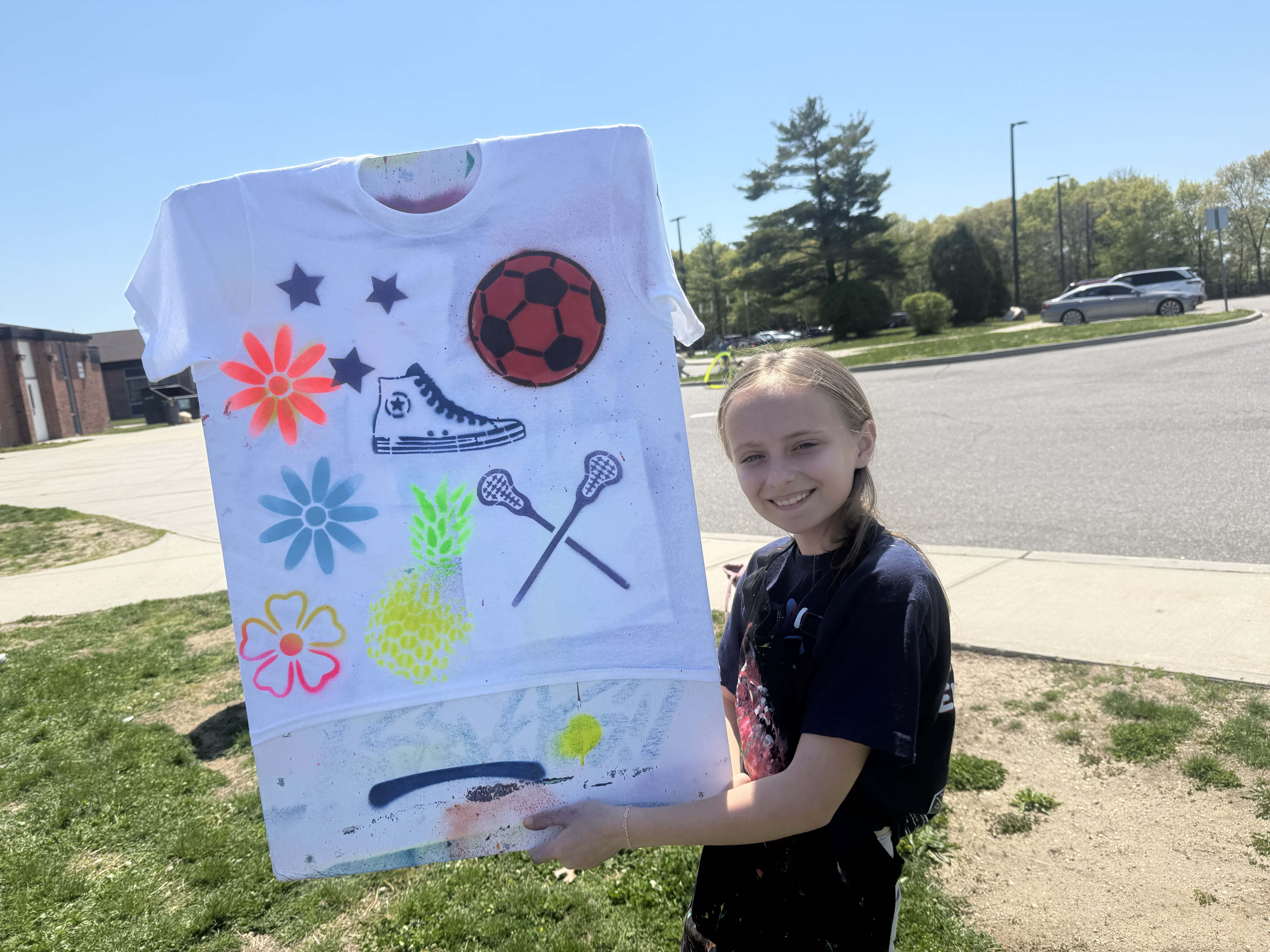 student holding poster board