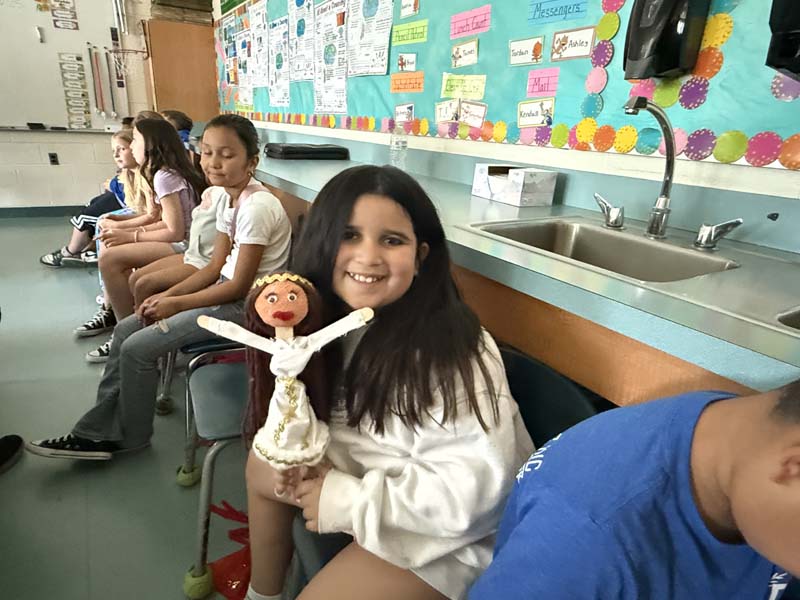 Students acting in a puppet show