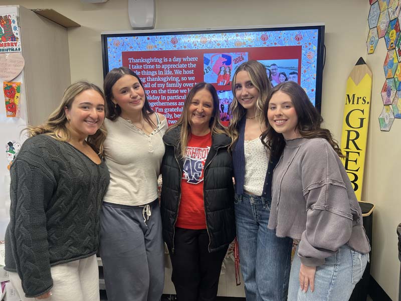 Picture of teacher and faculty