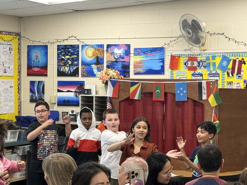 Students acting in a puppet show