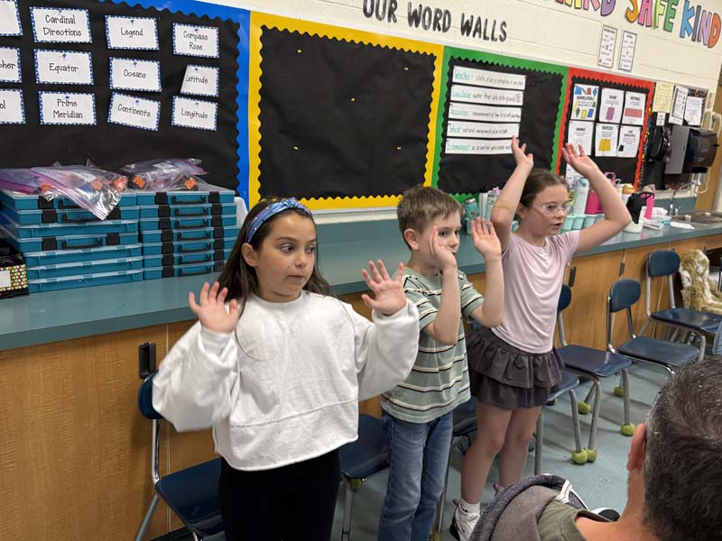 Students acting in a puppet show