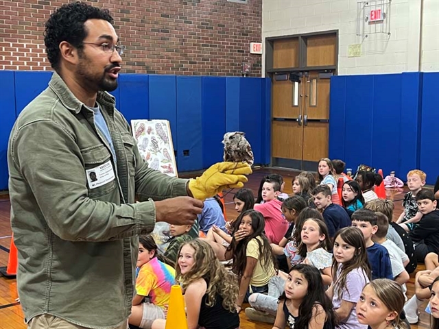 Educator with bird teaching