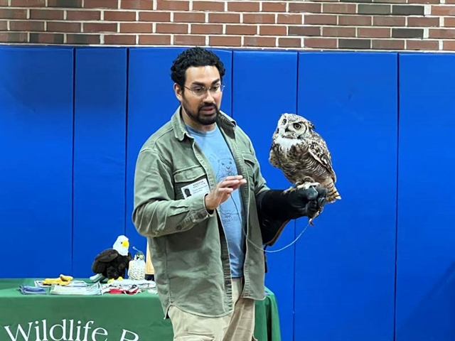Educator with bird teaching