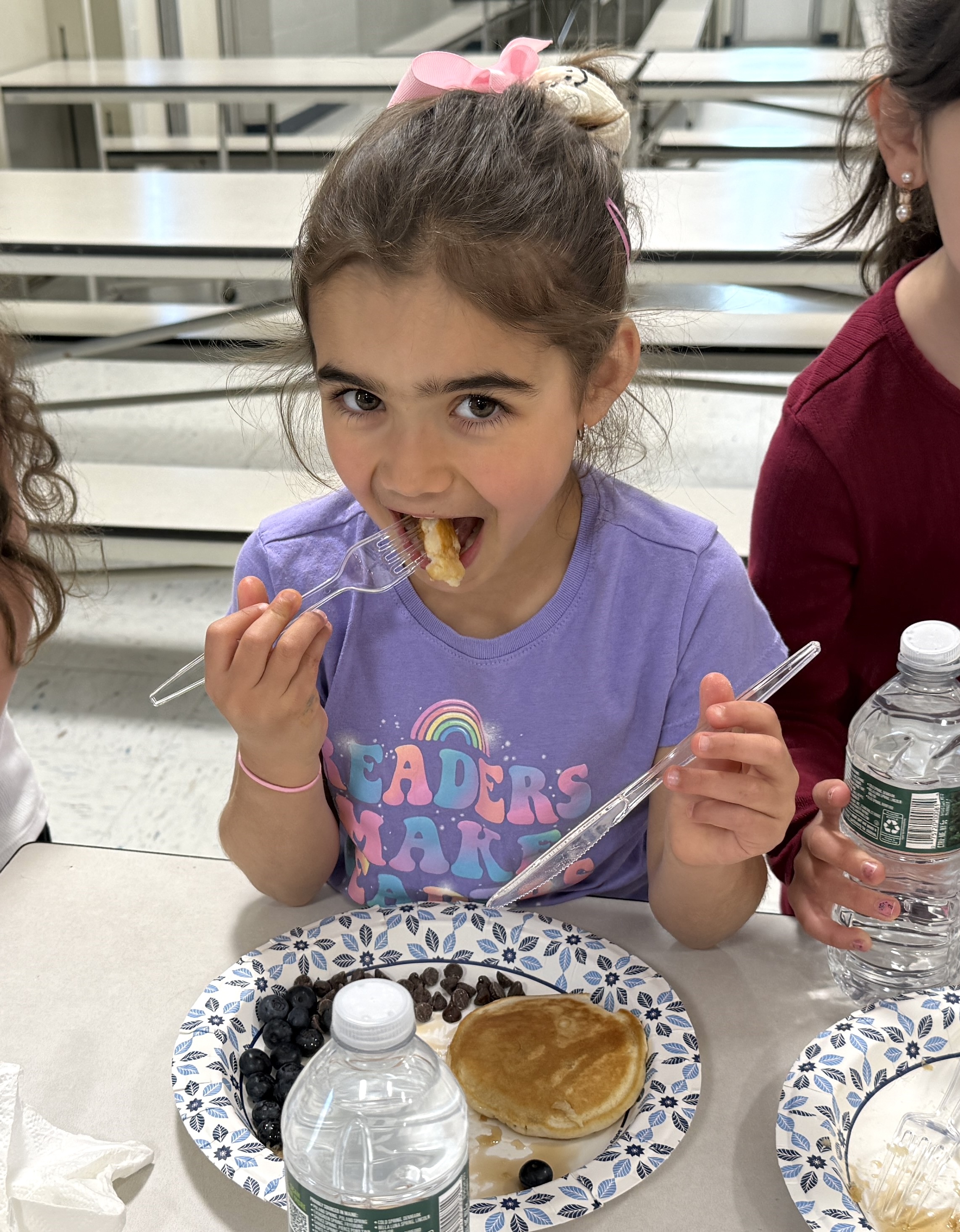 student eating pancake