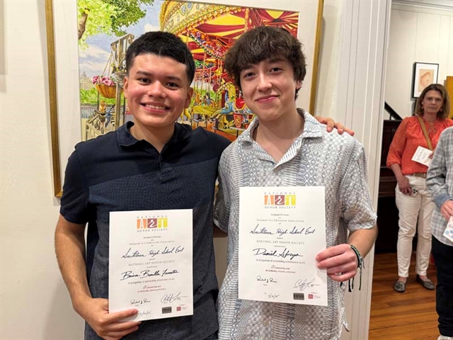 students holding certificates