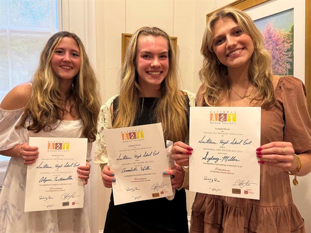 students holding certificates
