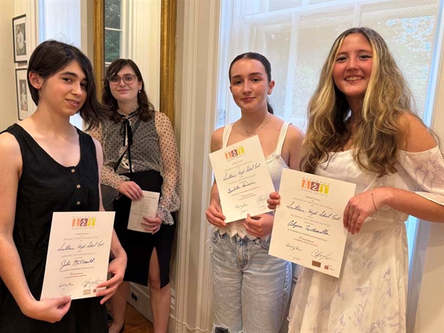 students holding certificates
