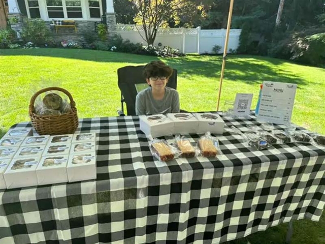 Max at his bakery stand