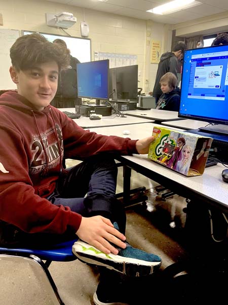 student coding at computer