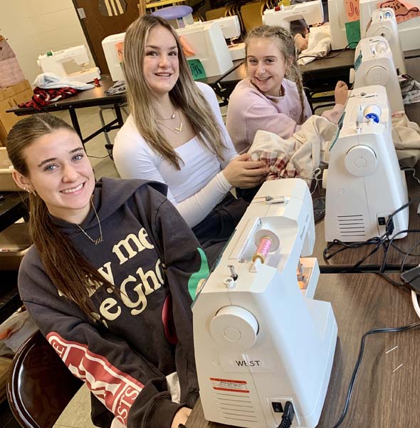 students by sewing machines