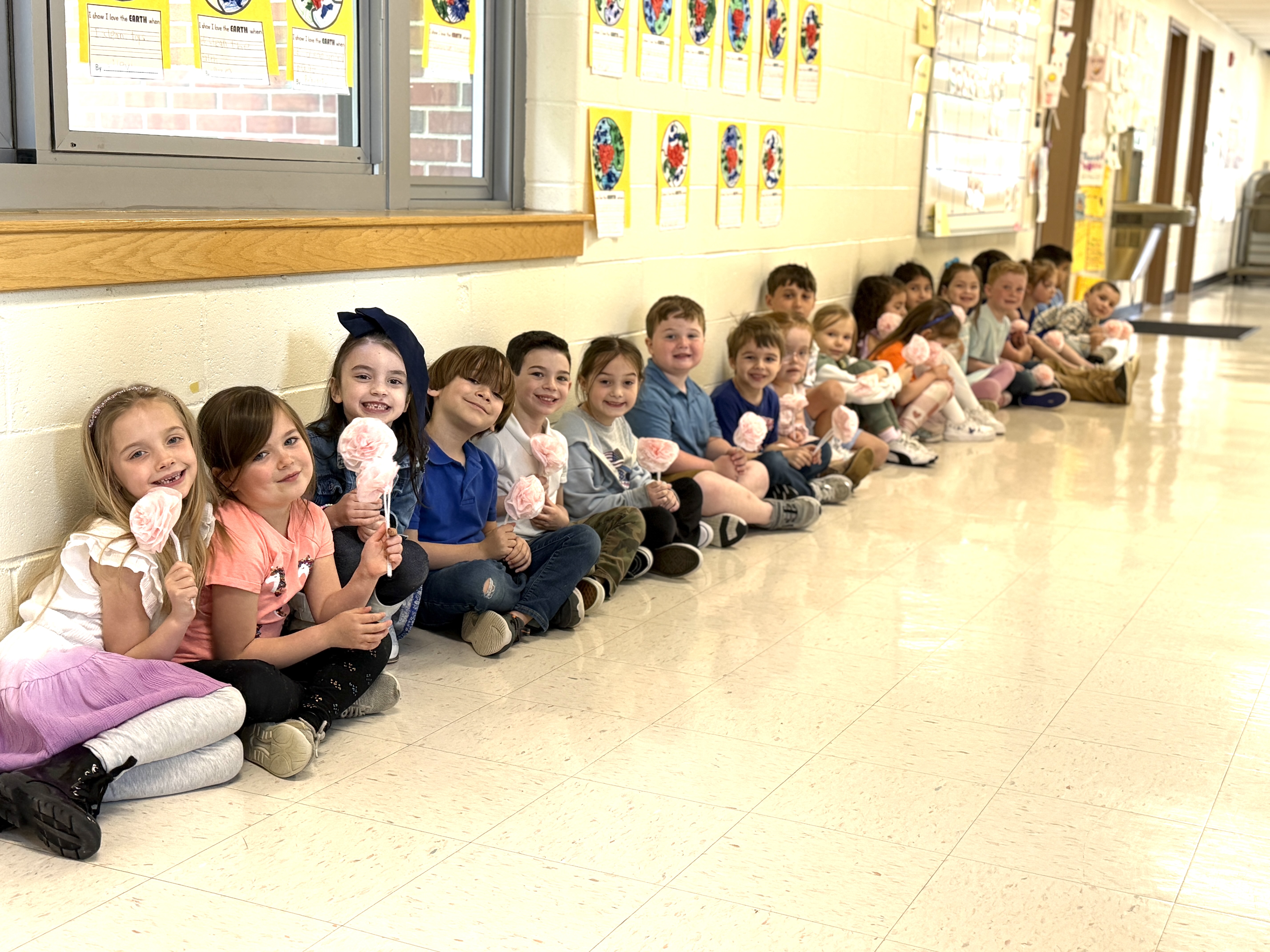 children sitting in hallway