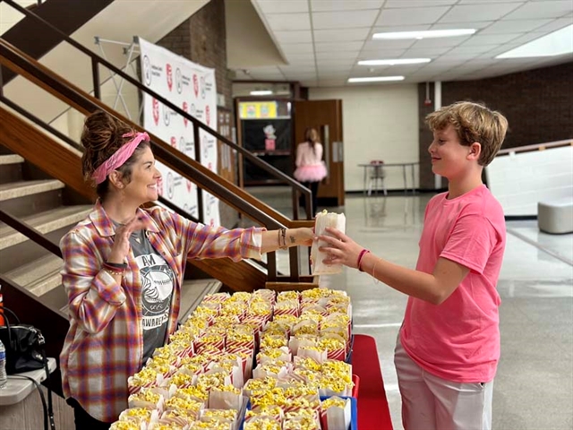 Gina Keely handing out popcorn