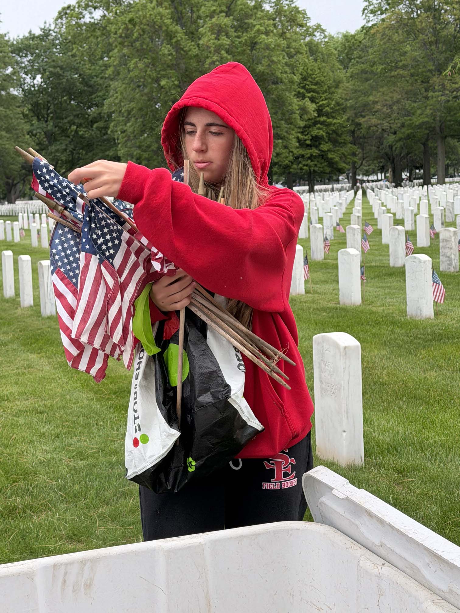 student holding flag