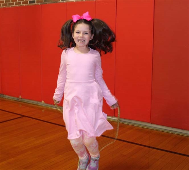Student wearing pink and jump roping