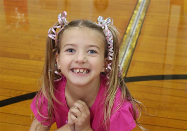 Student wearing pink and smiling