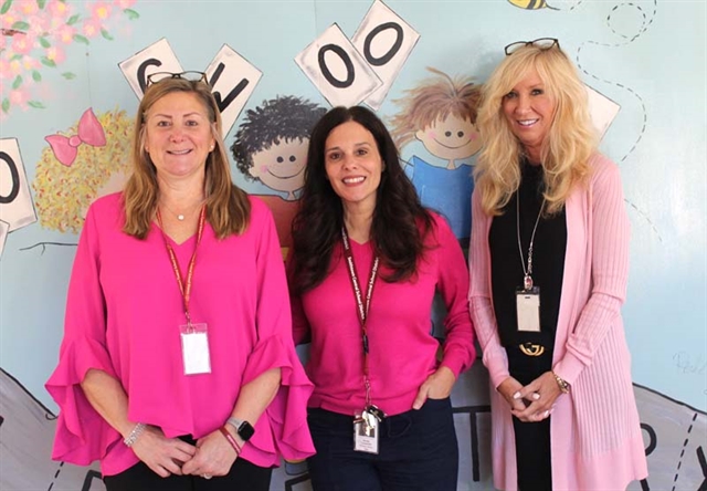 Principal Carptenter and staff wearing pink