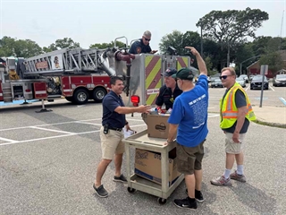 Principal and teachers in egg drop competition