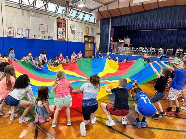 children playing under the parachute