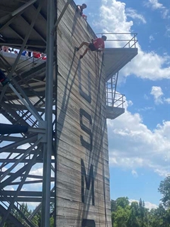 Person climbing up wall