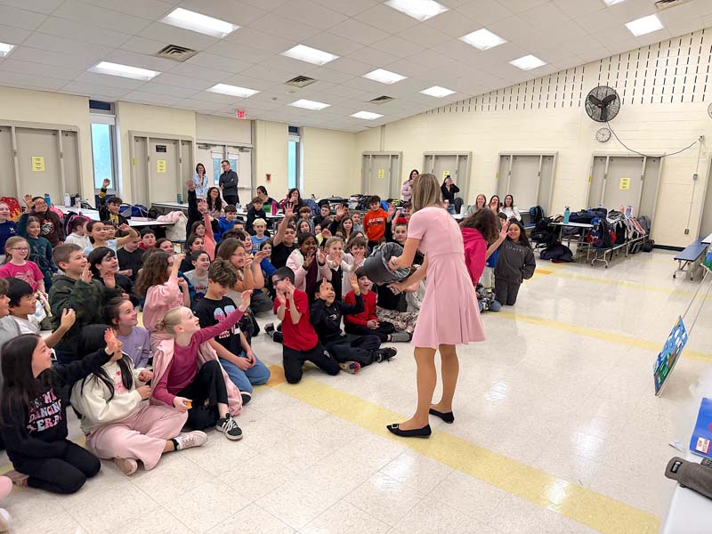 Sam Augeri teaching weather