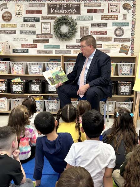 Dr. Secaur reading to students