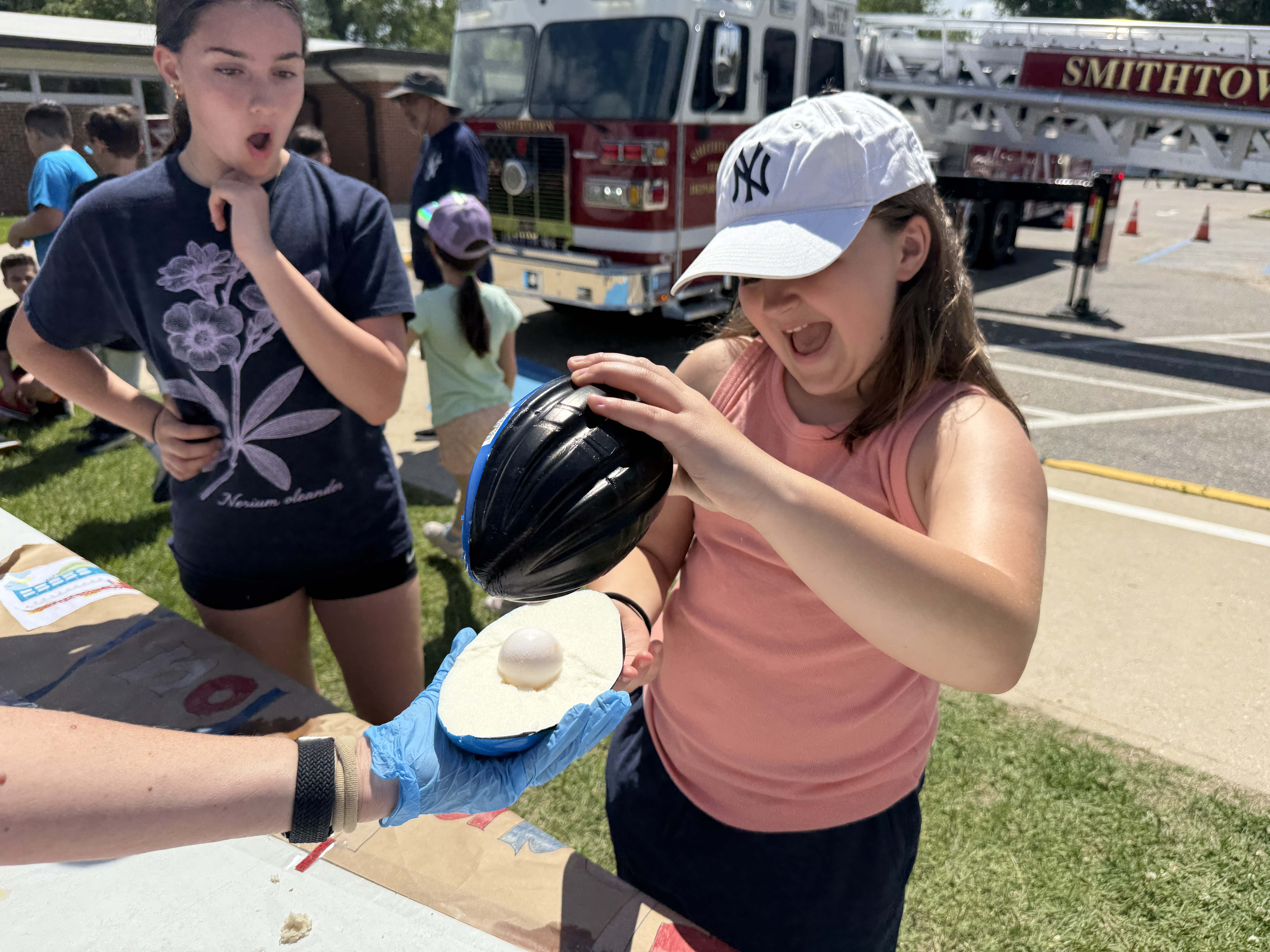 students playing with eggs