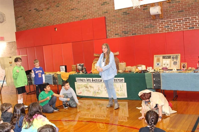 students learning about Native American culture