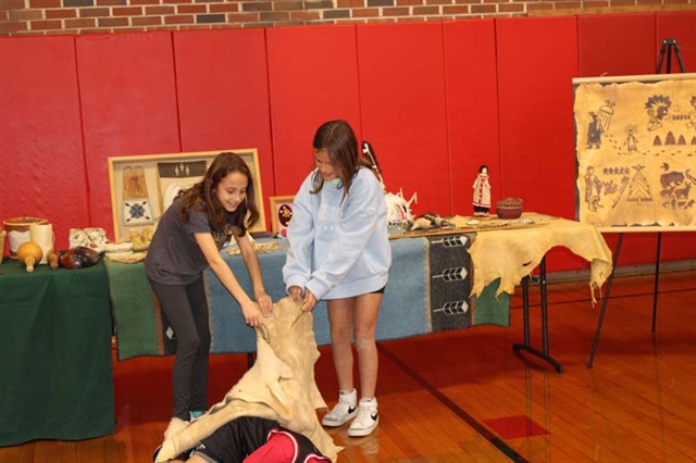 students learning about Native American culture