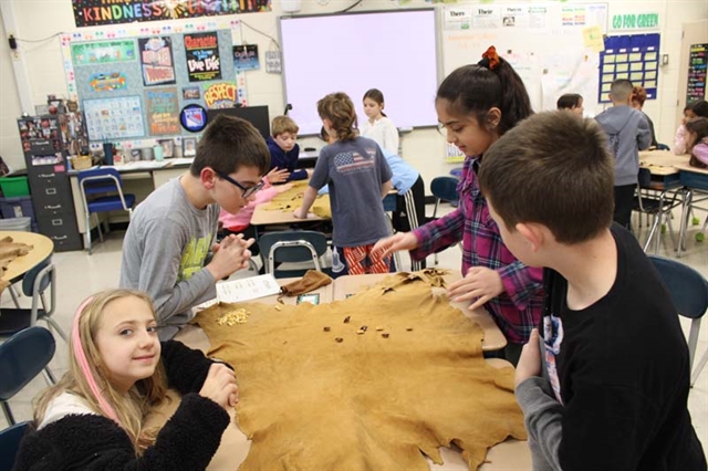 students learning about Native American culture