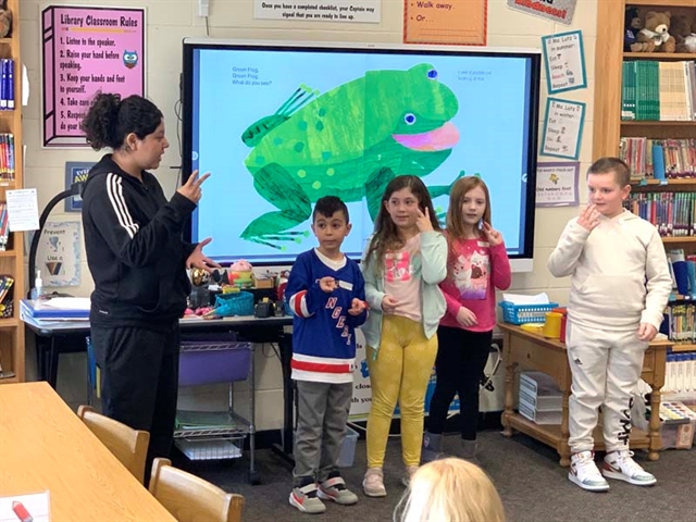 Students doing sign language at Mt. Pleasant