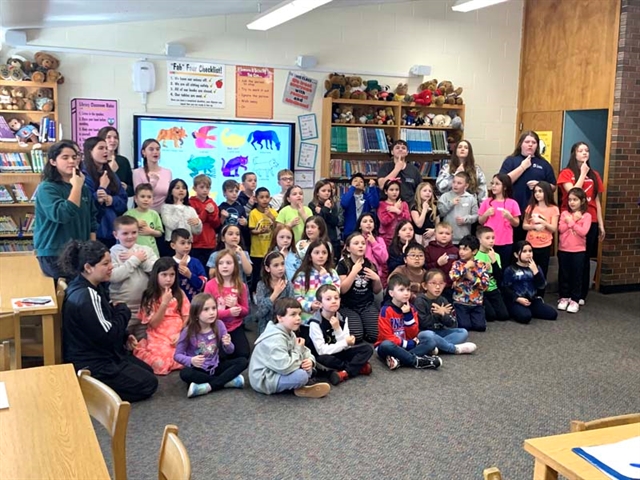 Students doing sign language at Mt. Pleasant