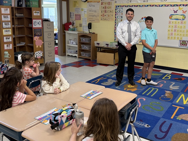 Principal and Logan in the classroom