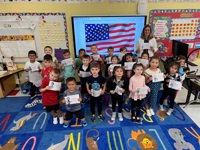 students in classroom smiling