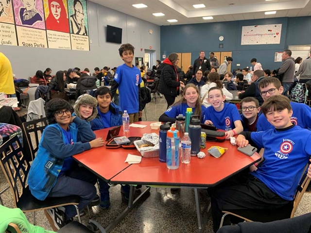 Robotics team posing for picture