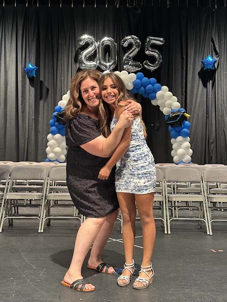 Teacher hugging student