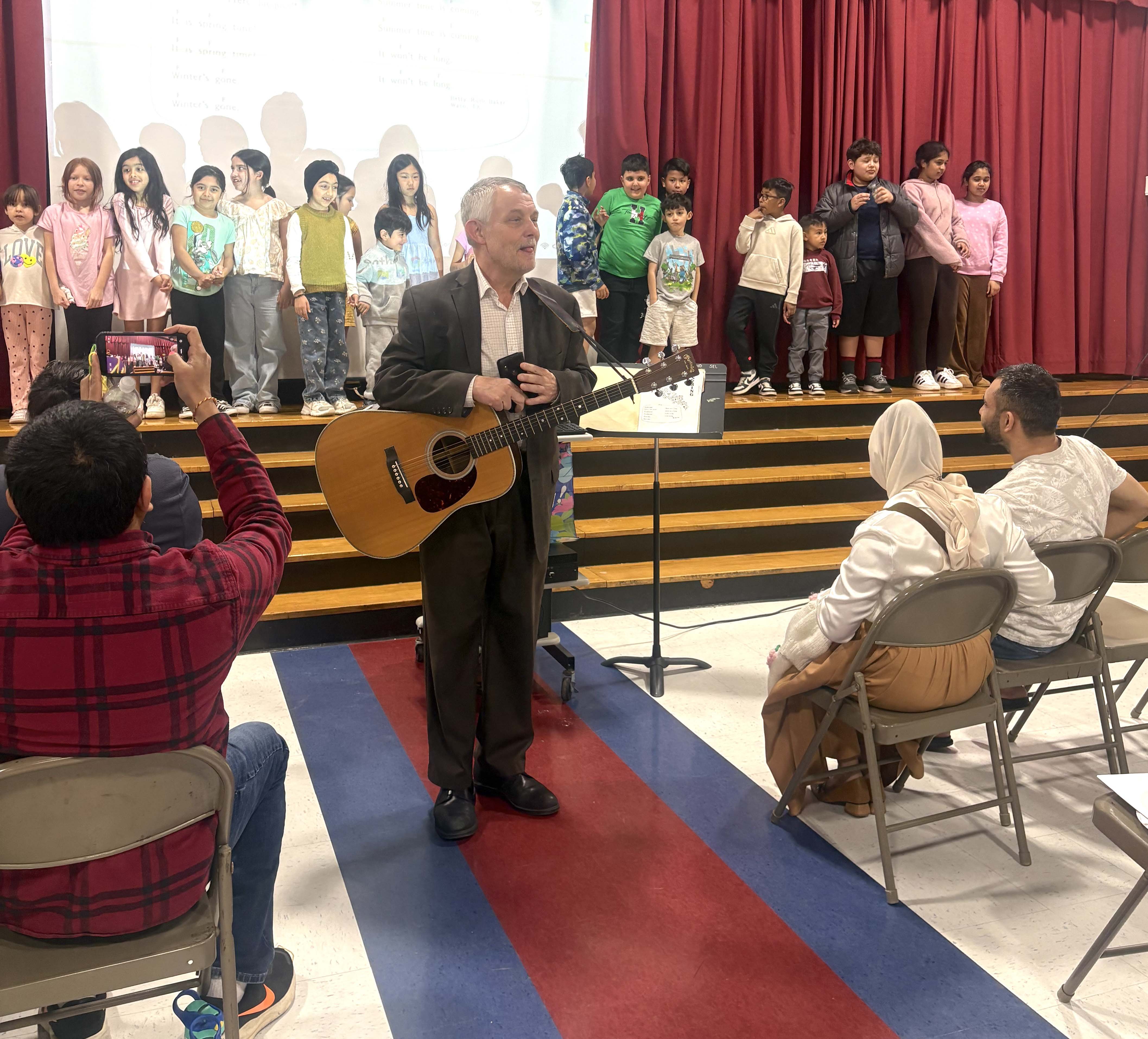 St. James teacher playing guitar