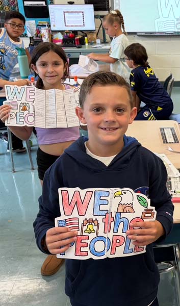 Students holding class rules