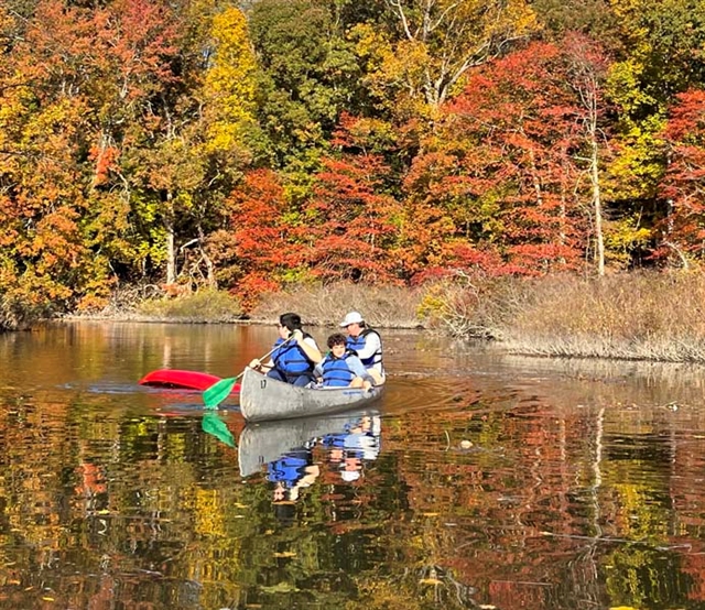 students on canoe