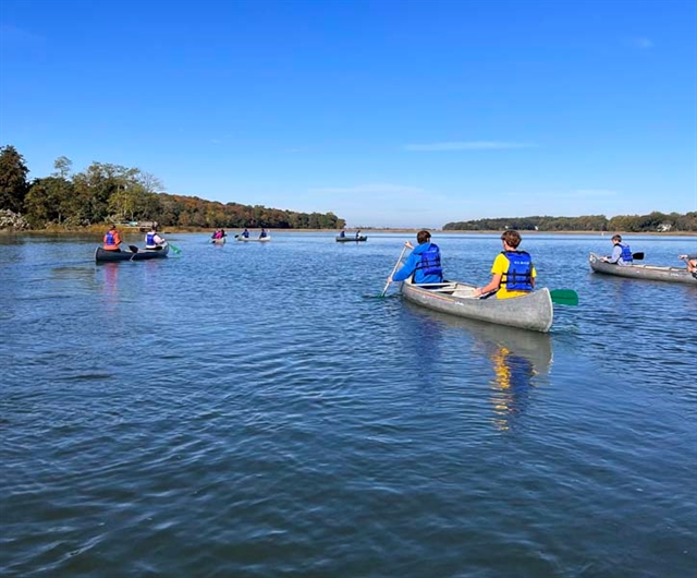 students on canoe