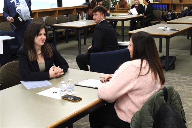 Students networking in HSE library