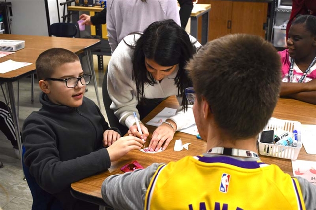 Students working on Valentine's Day project