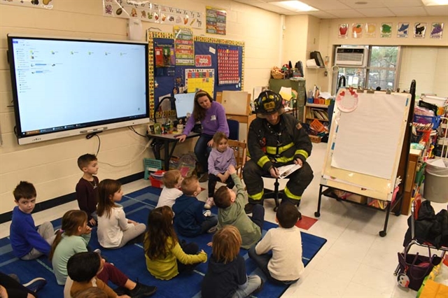 Firefighter reading to class
